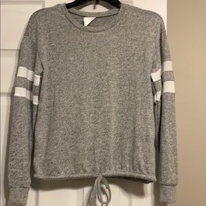 An adorable grey long sleeve top
